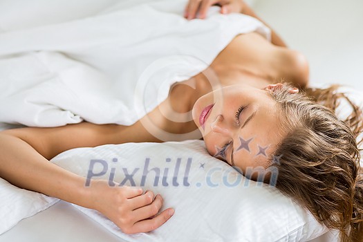 Beautiful young woman sleeping in bed Beautiful young woman sleeping in bed