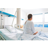 Senior male patient in a modern hospital. Getting better after a surgery/illness (shallow DOF; color toned image)