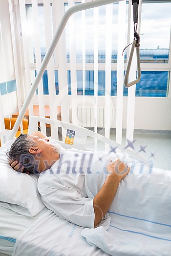Senior male patient in a modern hospital. Getting better after a surgery/illness (shallow DOF; color toned image) Senior male patient in a modern hospital. Getting better after a surgery/illness (shallow DOF; color toned image)