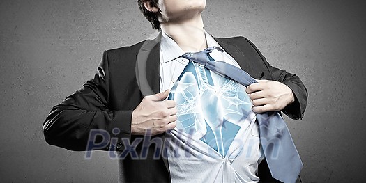 Businessman opening his shirt on chest acting like super hero Businessman opening his shirt on chest acting like super hero