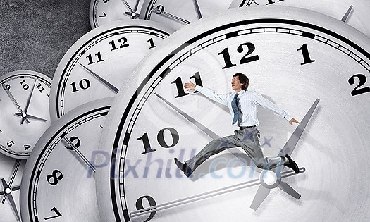 Concept of time with funny businessman running in a hurry Concept of time with funny businessman running in a hurry