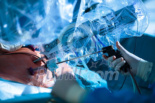 Surgery in a modern hospital being performed by a team of professionals (shallow DOF, color toned image) Surgery in a modern hospital being performed by a team of professionals (shallow DOF, color toned image)