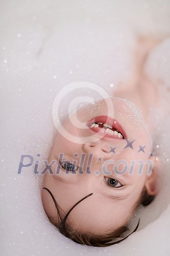 little girl playing with soap foam in bath during coronavirus stay at home pandemic quarantine little girl playing with soap foam in bath during coronavirus stay at home pandemic quarantine