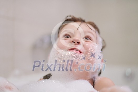little girl playing with soap foam in bath during coronavirus stay at home pandemic quarantine little girl playing with soap foam in bath during coronavirus stay at home pandemic quarantine