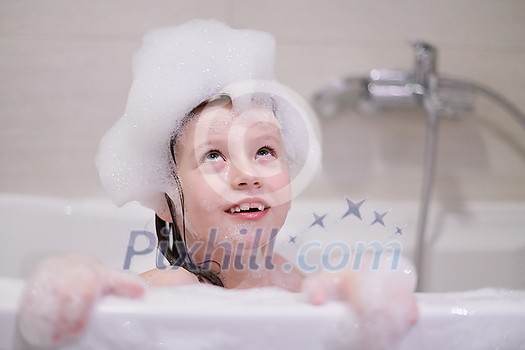 little girl playing with soap foam in bath during coronavirus stay at home pandemic quarantine little girl playing with soap foam in bath during coronavirus stay at home pandemic quarantine
