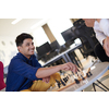 multiethnic group of business people playing chess while having a break in relaxation area at modern startup office