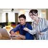 multiethnic business people Indian man with a female colleague working together on tablet and laptop computer in relaxation area of modern startup office