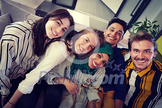 group of casual multiethnic business people during break from the work taking selfie picture while enjoying free time in relaxation area at modern open plan startup office group of casual multiethnic business people during break from the work taking selfie picture while enjoying free time in relaxation area at modern open plan startup office