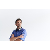 portrait of casual startup businessman with crossed arms wearing a blue shirt isolated on white background