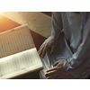 muslim man praying Allah alone inside the mosque and reading islamic holly book quran