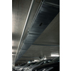 Underground parking. Cars parked in a garage with no people. Many cars in parking garage interior. Underground parking with cars (color toned image)