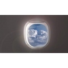 Panoramic aerial video of cloudscape from huge cumulus clouds lighted bright sunny beams on a blue clear sky background from window inside airplane in a summer day. 4K UHD video 3840, 2160p.