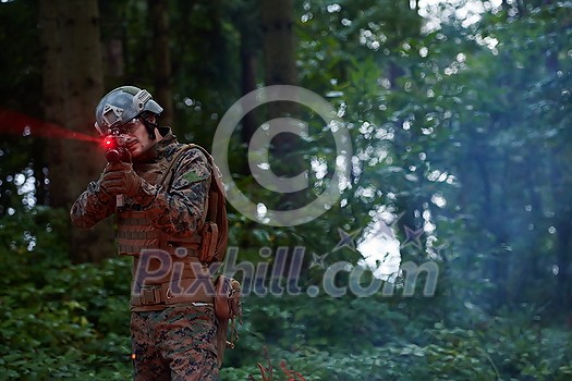 Soldier in Action at Night in the Forest Area. Night Time Military Mission Soldier in Action at Night in the Forest Area. Night Time Military Mission