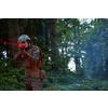 Soldier in Action at Night in the Forest Area. Night Time Military Mission
