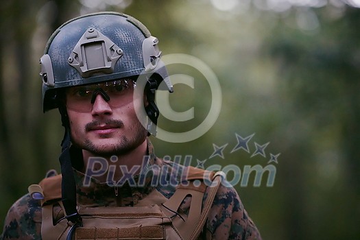 soldier portrait with protective army tactical gear and weapon having a break and relaxing soldier portrait with protective army tactical gear and weapon having a break and relaxing