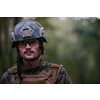 soldier portrait with  protective army tactical gear  and weapon having a break and relaxing
