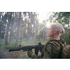 woman soldier ready for battle wearing protective military gear and weapon