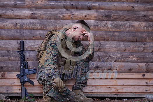 upset soldier has psychological problems holding his head upset soldier has psychological problems holding his head