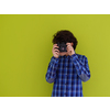 enthusuast arab teen photographer with analog slr camera on pink packground
