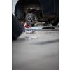 Car mechanic changing tires of a car in a repair shop/car garage (shallow DOF/color toned image)