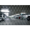 Underground parking. Cars parked in a garage with no people. Many cars in parking garage interior. Underground parking with cars (color toned image)