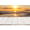 Empty perspective, white wooden boards or countertop against blurred seascape with sunset on background. Use as template and mockup for display or montage of your products. Close up, copy space