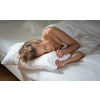 Beautiful young woman sleeping in bed