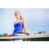 Portrait of a pretty, young tennis player  on  a court on a lovely summer day