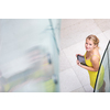 Pretty, young woman using a tablet computer in corporate context
