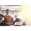 businessman portrait in modern startup business coworking space with bulb decoration representing concept of innovation and idea