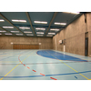 Interior of empty modern gymnasium - basketball, floorball, badminton, velleyball, soccer indoor sport courts