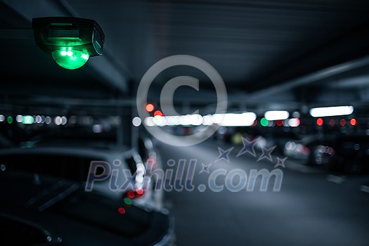 Free parking slot concept - Underground garage or modern car parking with lots of vehicles Free parking slot concept - Underground garage or modern car parking with lots of vehicles