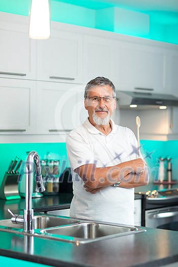 Senior man standing in his renovated, modern kitchen, Senior man standing in his renovated, modern kitchen,