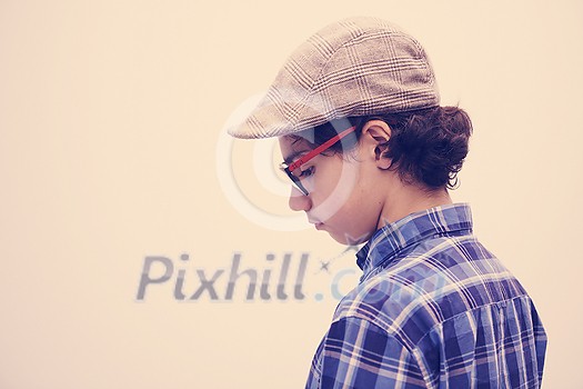 portrait of smart looking arab teenager with glasses wearing a hat in casual school look isolated on white copy space portrait of smart looking arab teenager with glasses wearing a hat in casual school look isolated on white copy space
