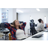 casual business woman taking a break while working on desktop computer in modern open plan startup office interior