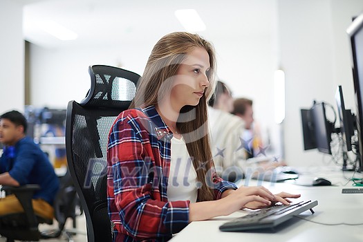 casual business woman working on desktop computer in modern open plan startup office interior casual business woman working on desktop computer in modern open plan startup office interior