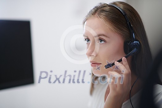 business and technology concept - helpline female operator with headphones in call centre Business woman with headsets working in a call center business and technology concept - helpline female operator with headphones in call centre Business woman with headsets working in a call center