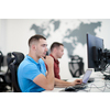 startup business, two male software developers working on computer at new modern open plan office