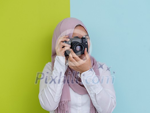 Portrait of Muslim woman photographer with slr camera. Portrait of Muslim woman photographer with slr camera.