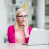 Pretty young college student in a library (shallow DOF; color toned image)