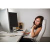 Woman working on a computer in a home office