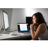 Woman working on a computer in a home office