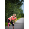 Young woman running outdoors on a lovely sunny winter/fall day