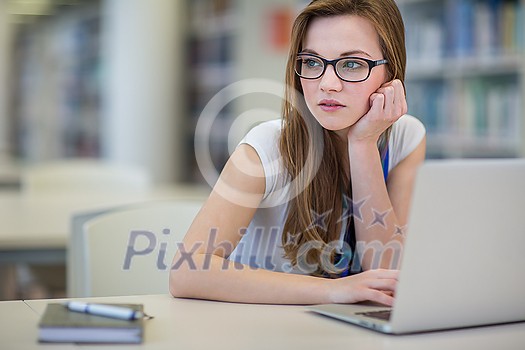 Pretty, female college student in a library, looking for a book (shallow DOF; color toned image) Pretty, female college student in a library, looking for a book (shallow DOF; color toned image)