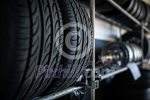 Tyres being stored in a garage - waiting for the client to have them put on his car Tyres being stored in a garage - waiting for the client to have them put on his car
