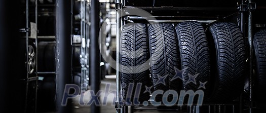 Tyres being stored in a garage - waiting for the client to have them put on his car Tyres being stored in a garage - waiting for the client to have them put on his car