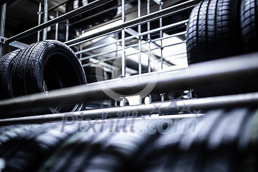Tyre change - wheel balancing or repair and change car tire at auto service garage or workshop by mechanic Tyre change - wheel balancing or repair and change car tire at auto service garage or workshop by mechanic