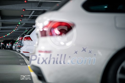 Underground garage or modern car parking with lots of vehicles, perspective Underground garage or modern car parking with lots of vehicles, perspective