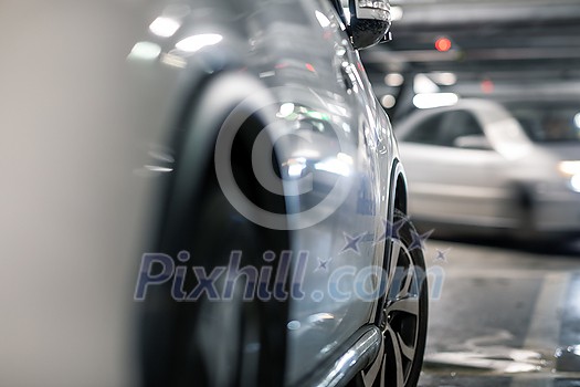 Underground garage or modern car parking with lots of vehicles, perspective Underground garage or modern car parking with lots of vehicles, perspective