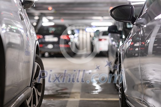 Underground garage or modern car parking with lots of vehicles, perspective Underground garage or modern car parking with lots of vehicles, perspective